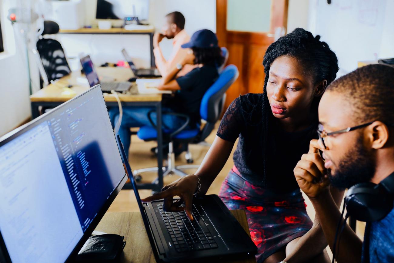 man and woman on laptop