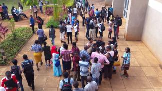students gather in university forecourt