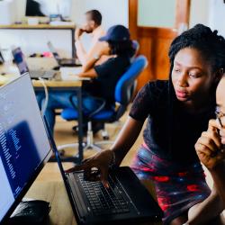 man and woman on laptop